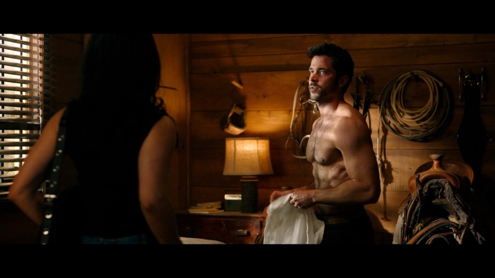 Ellie (Marianly Tejeda) and Yancy (Jack Schumacher) on the Fuller Ranchhouse set