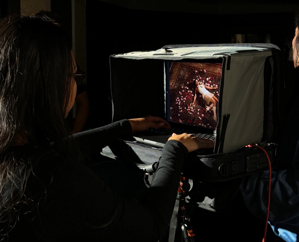 Emilynn Rose works at the tethered MacBook Pro