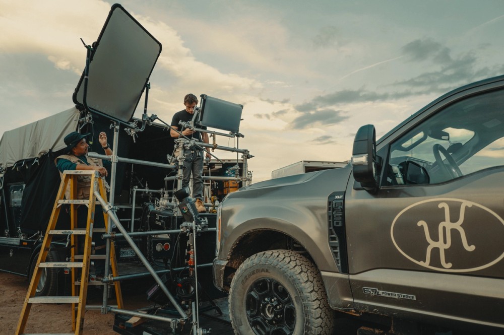Crew prepare a Light Storm 600c Pro and Lightbridge C100 bounce for a nighttime car rig shoot